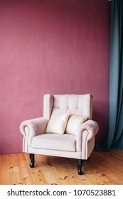 Pink Corduroy Chair With Cushions In The Room