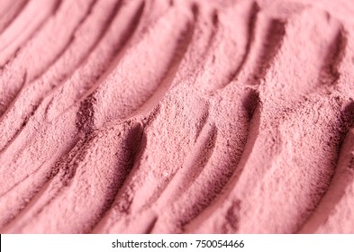 Pink Cosmetic Clay Powder Texture Close Up, Selective Focus. Abstract Background 