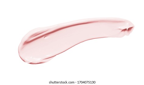 Pink cosmetic cream smear isolated on white background. Peach color beauty creme swipe. Skin care product creamy texture. Color correcting makeup primer smudge swatch