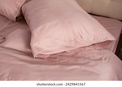 pink cotton bed linen pillows close up - Powered by Shutterstock