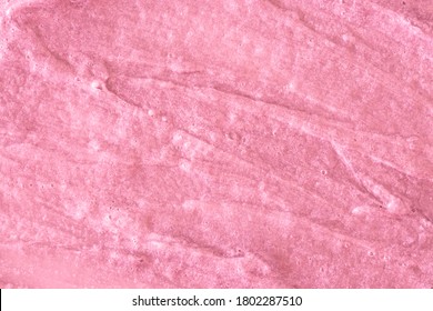 Pink Cream Texture. The Surface Of Berry Yogurt And A Smoothie Of Whipped Cream. Background Texture Of Masks And Scrubs For Face And Body. Pearlescent Silver Surface Of Pink Foam.