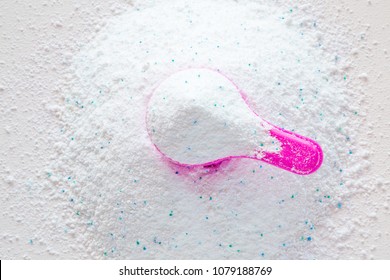 Pink cup or scoop of white powder. Detergent for clothes washing. Dry cleaning concept. Chores of housewife. Regular washing. Top view. - Shutterstock ID 1079188769