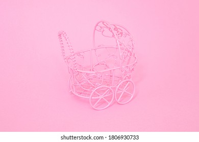 Pink Cute Decorative, Toy Stroller, Baby Stroller Close Up On Light Pink Background. 