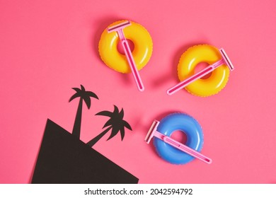 Pink Disposable Razors On Small Toy Balloons, Black Cardboard Palms On Pink Background, Body Hair Removal Before Beach Vacation Concept