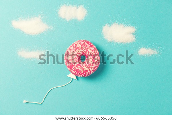 Pink Donut On Blue Background Creative Stock Photo 686565358 | Shutterstock