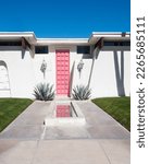 Pink door of a mid-century home in Palm Springs California