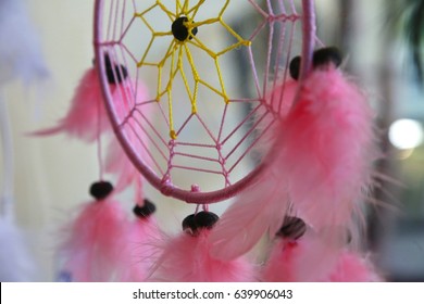 Pink Dream Weaver Feather Design Hanging In Window