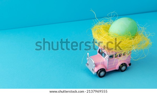 pink easter car with egg\
still life