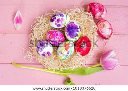 Pink Easter Eggs and Tulips Flowers  on a  Pink Wooden Background. Easter Decoration.  Decoupage ideas .