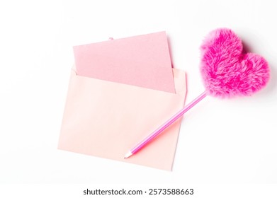 Pink Envelope and Accessories for Creative Customization. Heart-shaped fluffy pen.