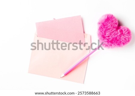 Pink Envelope and Accessories for Creative Customization. Heart-shaped fluffy pen.