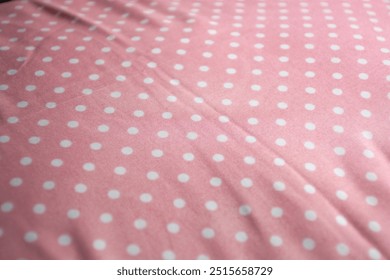 pink fabric texture with dot pattern motive for background
