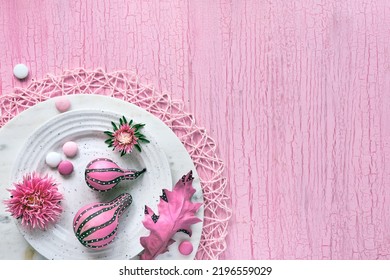 Pink Fall Decor. Panoramic Banner Image. Stripy Pumpkins, Dry Autumn Leaves, Flowers On A White Plate. Fuchsia Painted Objects On Pink Textured Background. Monochromatic Flat Lay, Copy-space.