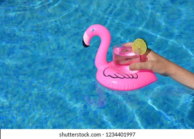 Pink Flamingo Drink Holder Floating In Swimming Pool