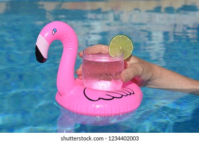 Pink Flamingo Drink Holder Floating In Swimming Pool