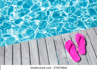 Pink Flip Flops By The Swimming Pool