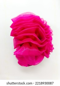 The Pink Flower Hair Clip On The White Paper