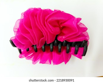 The Pink Flower Hair Clip On The White Paper