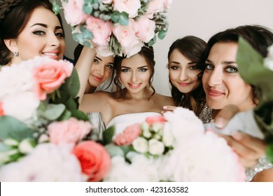 Pink flowers and bride's face in the middle - Powered by Shutterstock