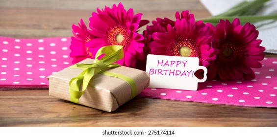 Pink flowers and card with lettering happy birthday