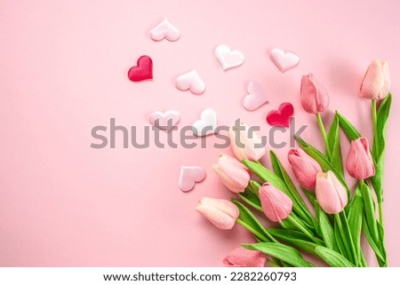 Pink flowers, hearts on pastel pink background. woman day. mothers day.
