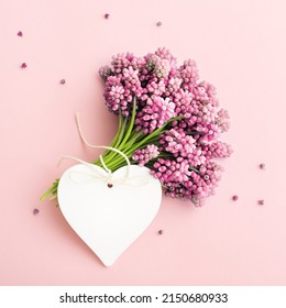 Pink flowers and white heart shape greeting card mock up for Mother's Day. - Shutterstock ID 2150680933
