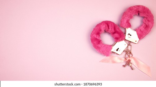 Pink Fluffy Handcuff On A Pink Background. Happy Valentine's Day Banner With Place For Text