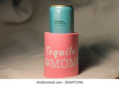 Pink Foam Can Cooler With Drink