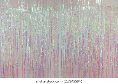 pink foil fringe curtain or plastic rope party decoration.