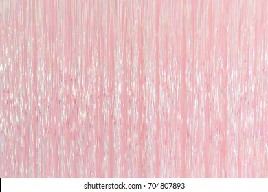 pink foil fringe curtain or plastic rope party decoration backdrop.