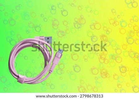 Pink folded usb plug cable for connection on green yelow