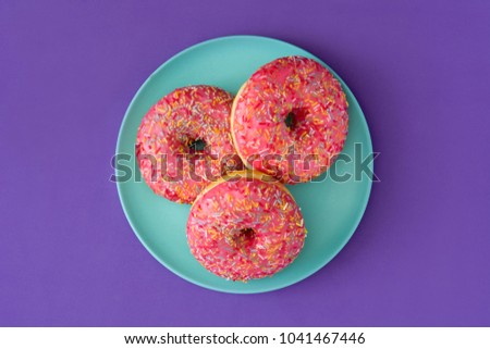 Similar – Pink frosted donut Roll