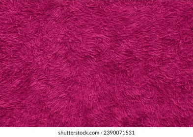 Pink fur texture top view. Pink sheepskin background. Fur pattern