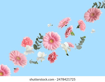 Pink gerberas and other beautiful flowers flying on light blue background - Powered by Shutterstock