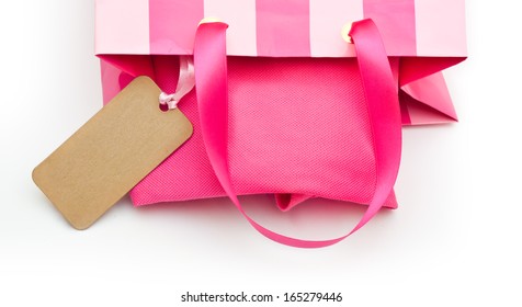 Pink Gift Bag With Tag On A White Background