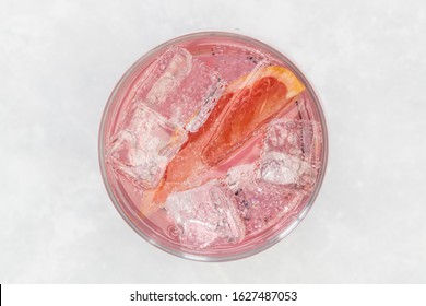 Pink Gin Tonic Vodka Soda Fruit Grapefruit Cocktail Drink In Glass With Ice, Top View On White Background