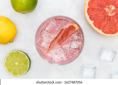 Pink Gin Tonic Vodka Soda Fruit Grapefruit Cocktail Drink In Glass With Ice, Top View On White Background