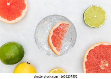 Pink Gin Tonic Vodka Soda Fruit Grapefruit Cocktail Drink In Glass With Ice, Top View On White Background