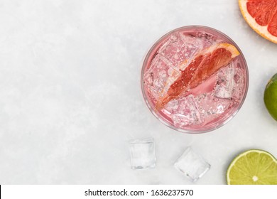 Pink Gin Tonic Vodka Soda Fruit Grapefruit Cocktail Drink In Glass With Ice, Top View On White Background