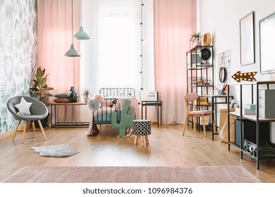 Pink Girl Room Interior With A Single Bed, Shelves, Grey Armchair And Cactus Shaped Pillow