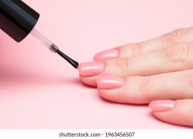 Pink Glitter Manicure. The Manicure Brush Does Not Wear Nail Polish.