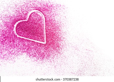 Pink Glitter Shaped As A Heart On White Background. Copy Space.