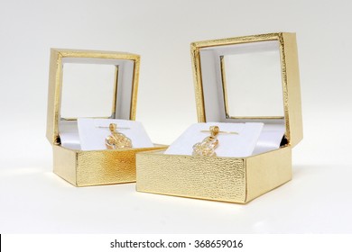 Pink Gold Necklace In A Box On White Background