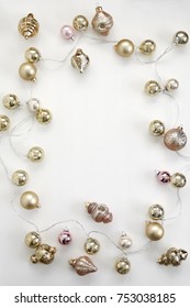 Pink And Gold Vintage Christmas Ornaments And Antique Mercury Glass String Lights Flat Lay Composition For Bloggers, Magazines, Social Media And Artists. Top View.