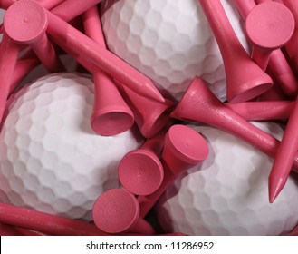 Pink Golf Tees set on white Golf Balls