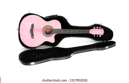 pink guitar in a case on a white background
