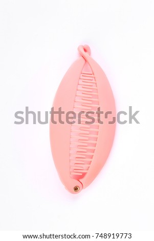 Pink hair banana clip over white. Beautiful clip for hair isolated on white background. Hair accessory for girls.