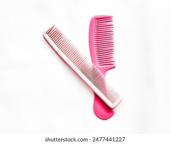 pink hair comb isolated on white background - Powered by Shutterstock
