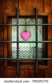 A Pink Heart Behind The Bars 