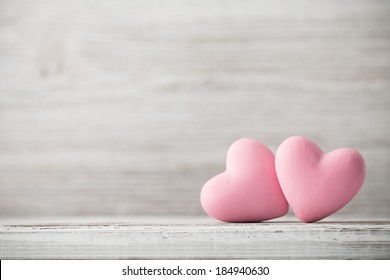 Pink heart on the wooden background. Provencal style.